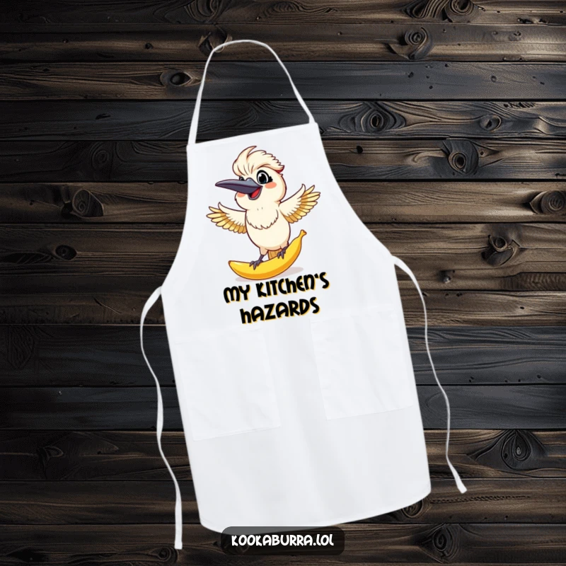 Funny Kookaburra Apron: Kookaburra grinning as it catches a giant banana peel, perfect for a funny chef.