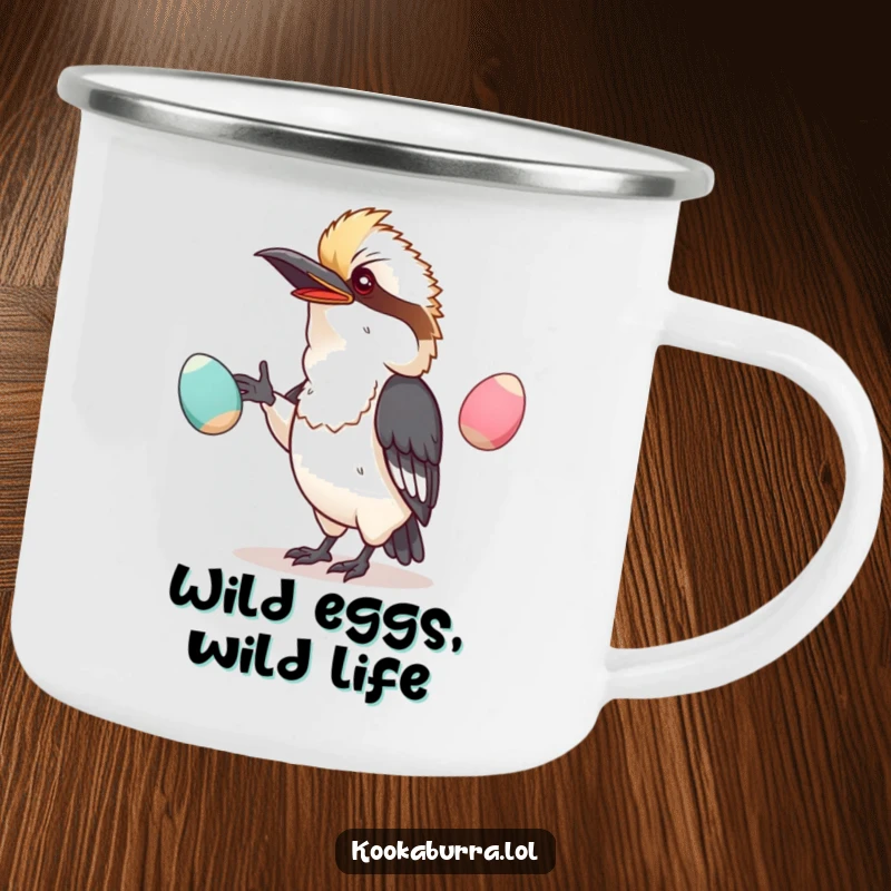 Funny camping mug with a kawaii kookaburra hilariously juggling wobbly eggs, ready for outdoor enjoyment.