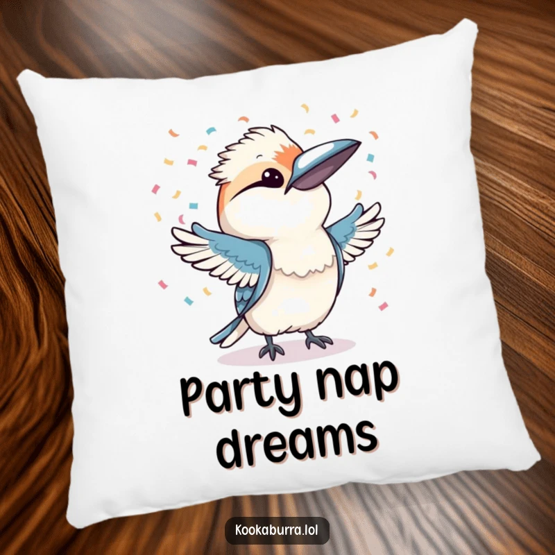 Funny kookaburra joyfully throwing confetti with both wings, depicted on a soft pillow for festive comfort.
