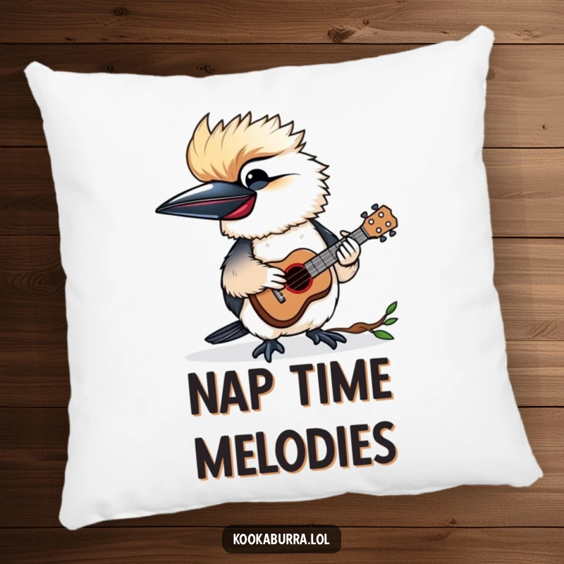 Funny pillow featuring a kookaburra happily playing a tiny ukulele, adding musical charm and comfort.