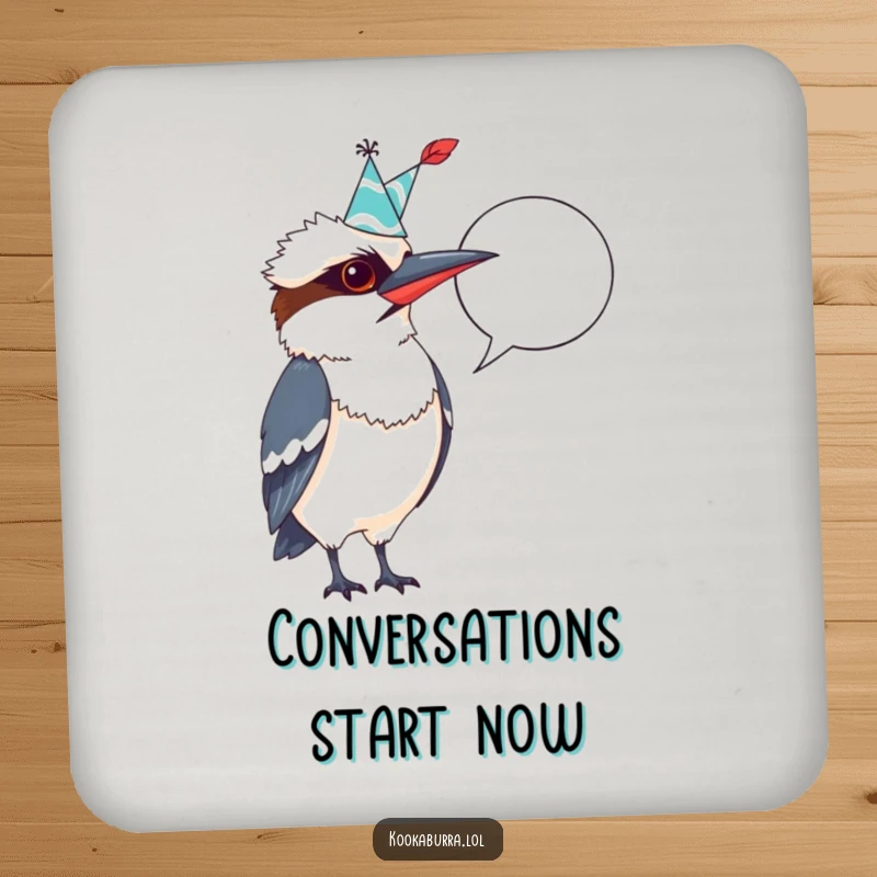 Funny Kookaburra Coaster: A kookaburra in a party hat, quill in hand, pointing at a blank speech bubble, for witty drink protection.