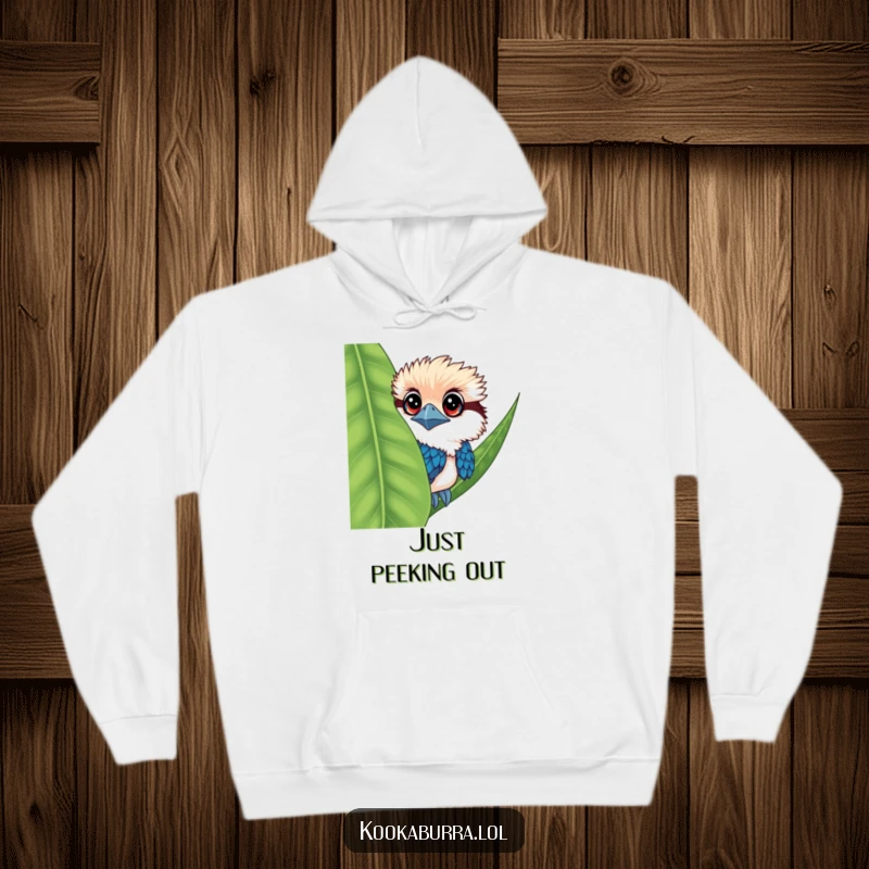Funny kookaburra hoodie with a large-eyed bird peeking from behind a leaf, soft and intriguing.