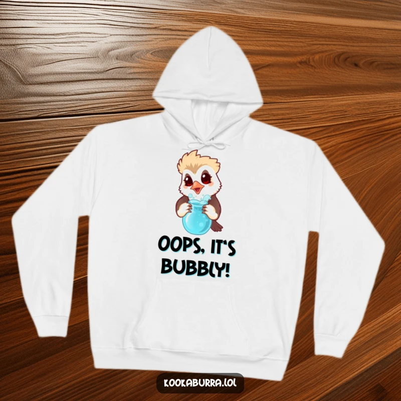 Funny hoodie depicting a kookaburra with a surprised expression holding a bubbling potion, perfect for cozy, mysterious evenings.