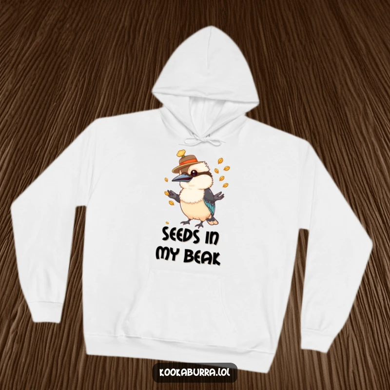 Funny kookaburra hoodie featuring a bird in a hat, expertly juggling a pile of shiny seeds.