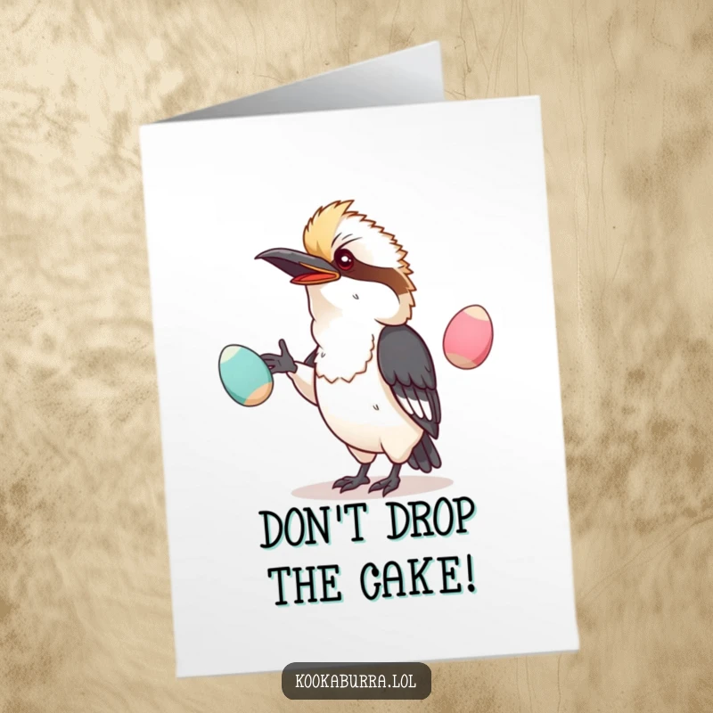 Funny Free Printable Birthday Card: Kawaii kookaburra precariously juggling large, wobbly eggs with a determined look.