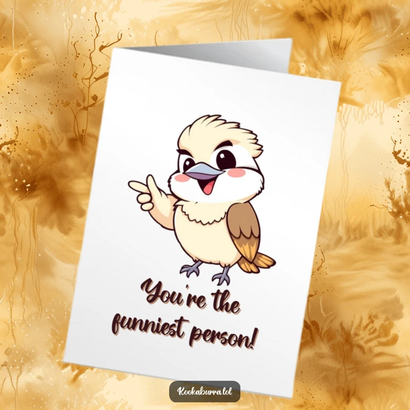 Funny Free Printable Birthday Card: Kawaii kookaburra pointing gleefully with a wide, mischievous grin and playful eyes.