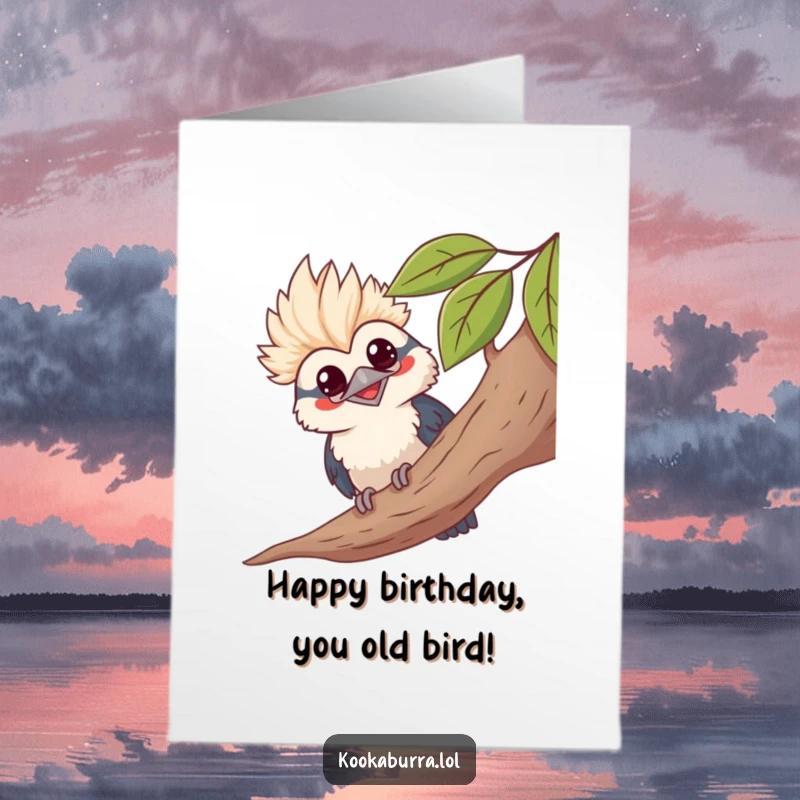 Funny Free Printable Birthday Card, showing a kawaii kookaburra peeking from behind a leafy branch with a wide, mischievous grin.