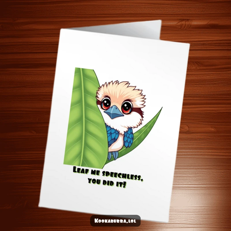 Funny Free Printable Kookaburra Congratulations Card: A kookaburra peeks out from behind a leaf, its big eyes conveying playful congrats.