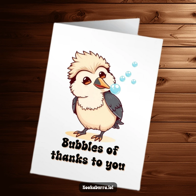 Funny Free Printable Thank You Card: A happy, amused kawaii kookaburra blowing a stream of shimmering bubbles.