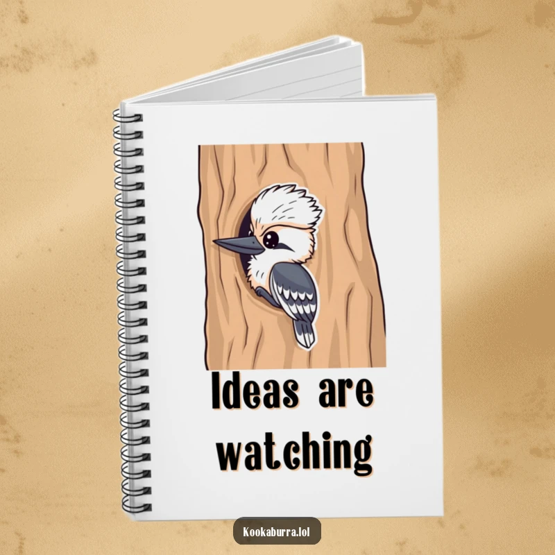 Funny kookaburra notebook, a playful bird peeking from a tree, designed for jotting down notes with a humorous touch.