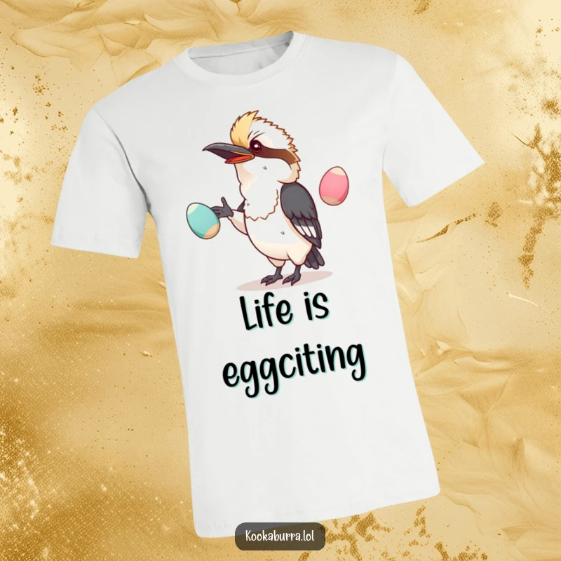 Funny t-shirt featuring a kawaii kookaburra struggling to juggle oversized, wobbly eggs, looking comically focused.