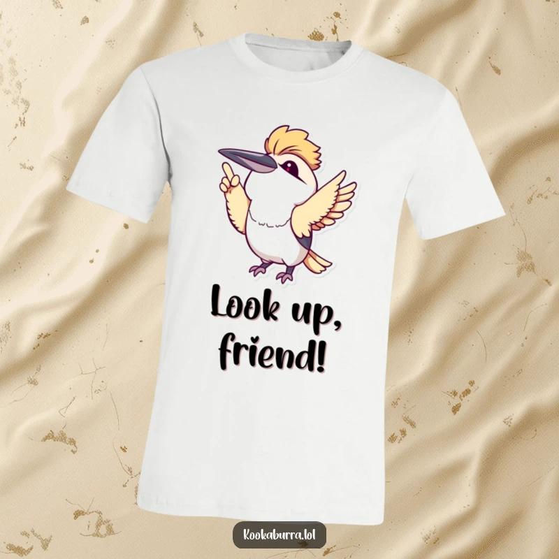 Adorable kawaii kookaburra pointing excitedly upwards with its wing, designed on a t-shirt for maximum charm.