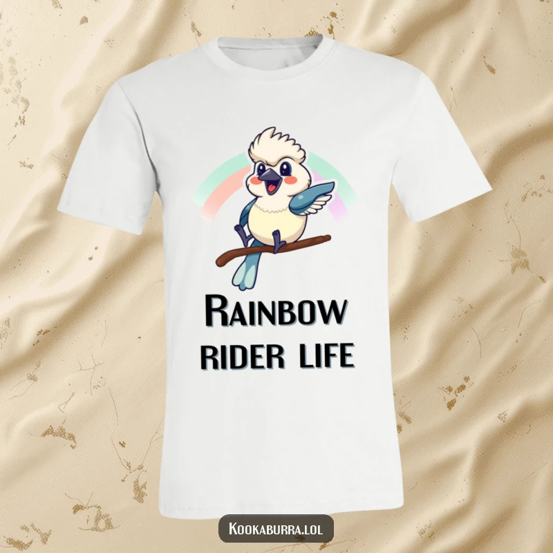 Funny t-shirt featuring a kookaburra joyfully sliding down a rainbow with a massive grin, capturing whimsical happiness.