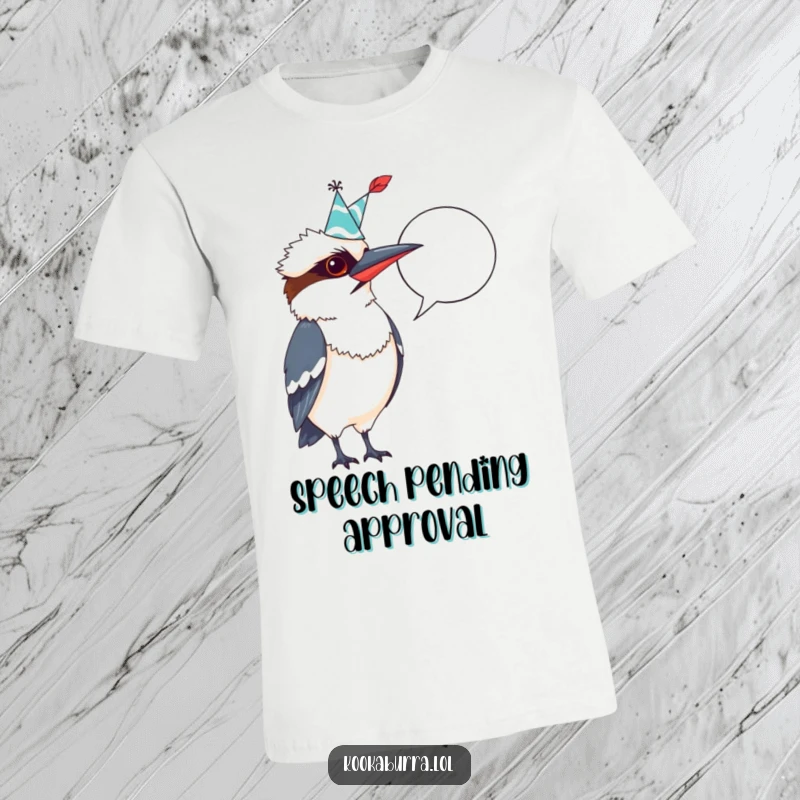 Funny Kookaburra T-Shirt: Wearing a party hat, dramatically pointing a feather quill at an empty speech bubble, ready for punchlines.