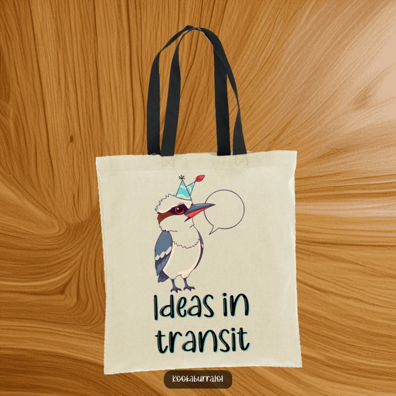 Funny Kookaburra Tote Bag: Quirky bird with party hat and quill, pointing at a blank speech bubble, ready to carry your stuff.