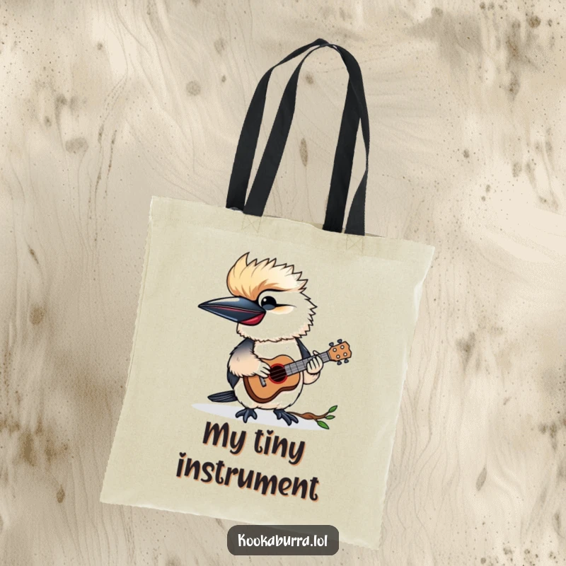 Funny tote bag with a kookaburra happily playing a tiny ukulele, great for music lovers and everyday use.